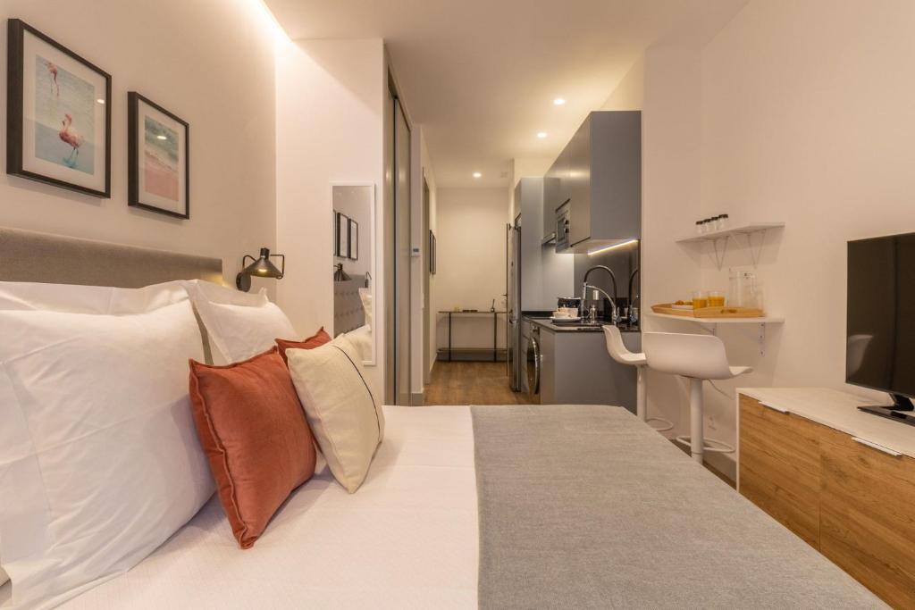 Voodi või voodid majutusasutuse Small Loft for 2 in Chamberi Quevedo II toas