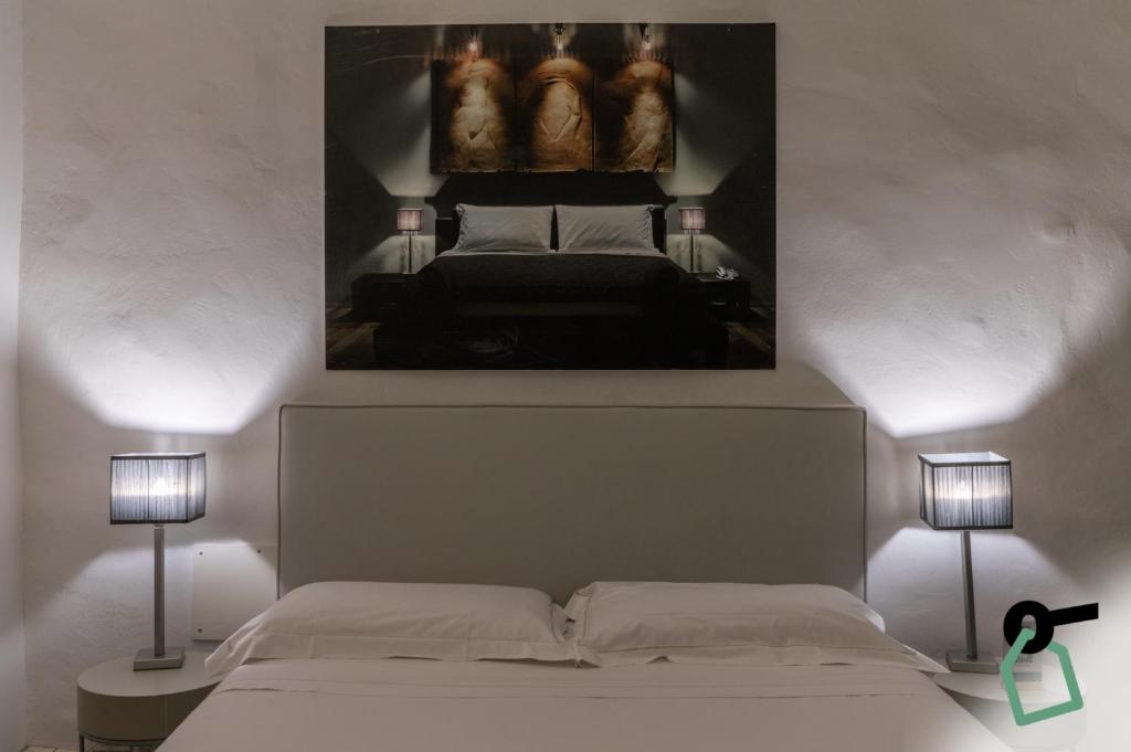 Postel nebo postele na pokoji v ubytování Hotiday Room Collection - Firenze Ghibellina