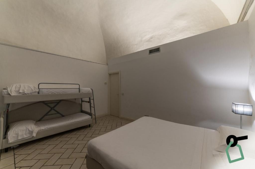 Postel nebo postele na pokoji v ubytování Hotiday Room Collection - Firenze Ghibellina
