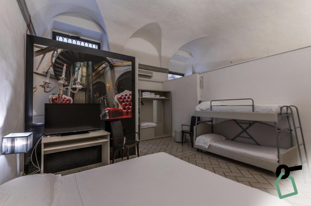 Postel nebo postele na pokoji v ubytování Hotiday Room Collection - Firenze Ghibellina