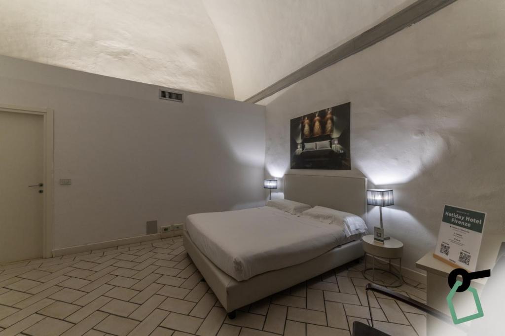Postel nebo postele na pokoji v ubytování Hotiday Room Collection - Firenze Ghibellina