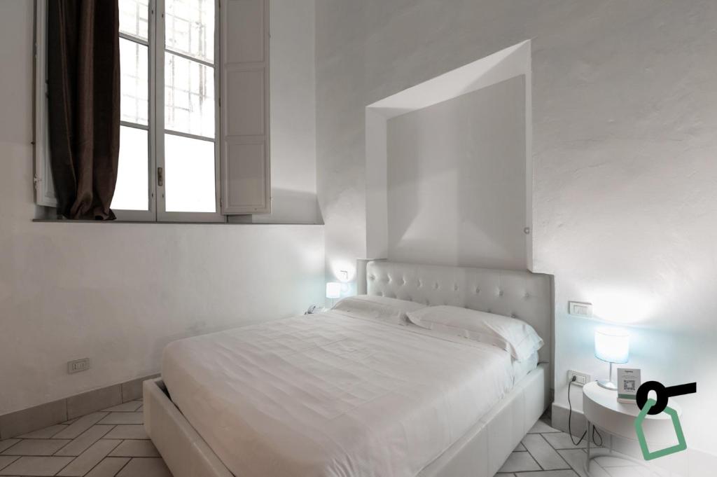 Postel nebo postele na pokoji v ubytování Hotiday Room Collection - Firenze Ghibellina