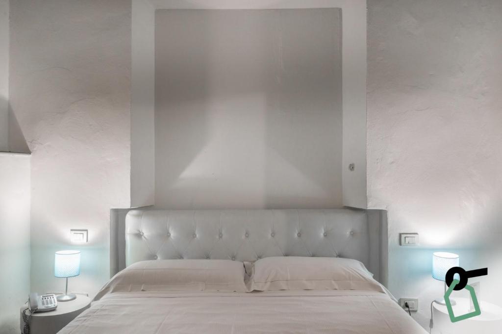 Postel nebo postele na pokoji v ubytování Hotiday Room Collection - Firenze Ghibellina