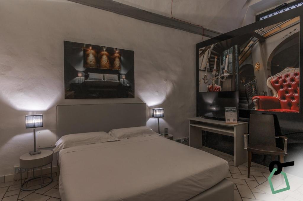 Postel nebo postele na pokoji v ubytování Hotiday Room Collection - Firenze Ghibellina