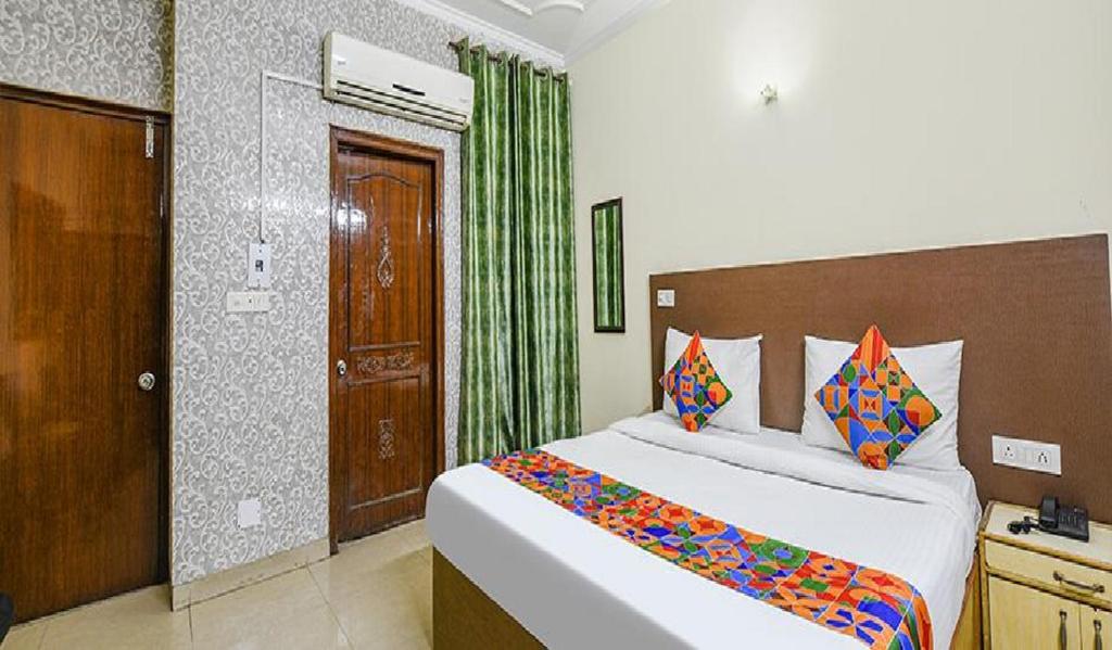 Postel nebo postele na pokoji v ubytování Hotel Smart Stay