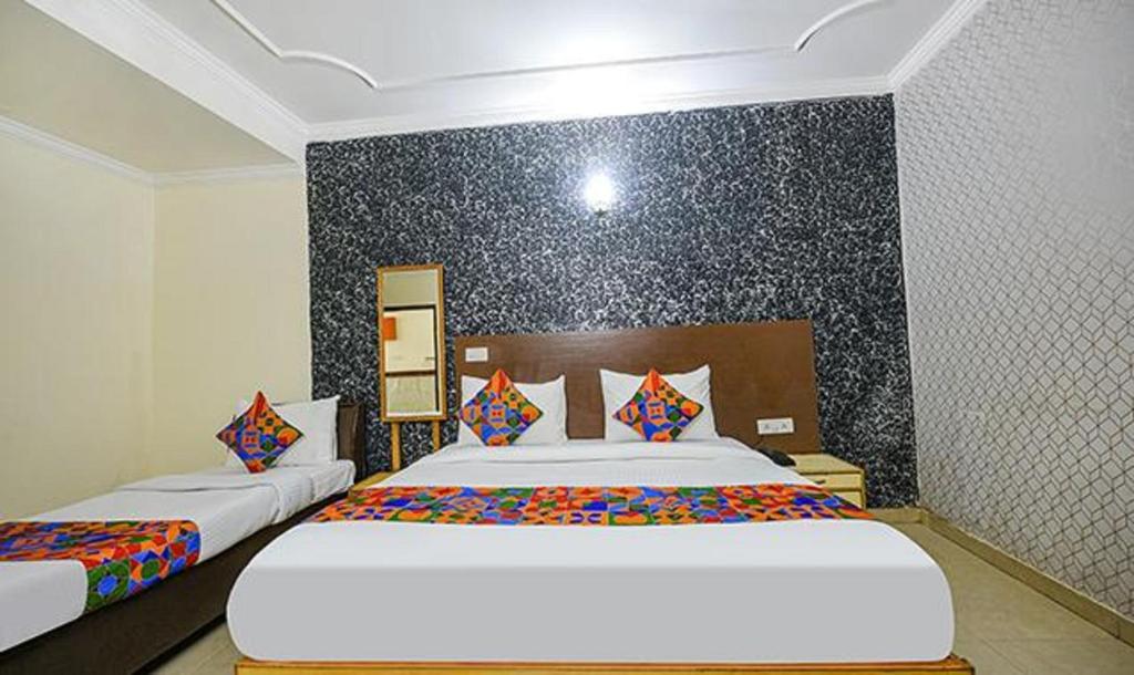 Postel nebo postele na pokoji v ubytování Hotel Smart Stay