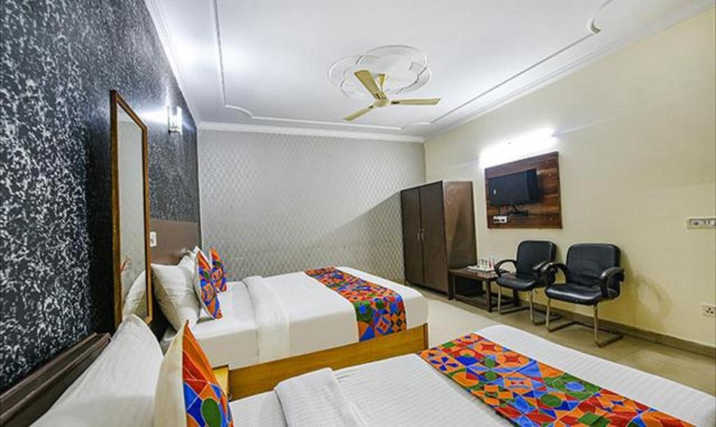 Postel nebo postele na pokoji v ubytování Hotel Smart Stay