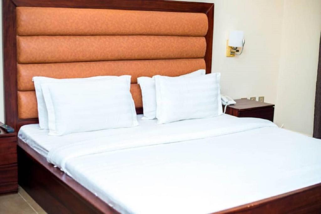 Postel nebo postele na pokoji v ubytování Hôtel Guest House Quatre Saisons