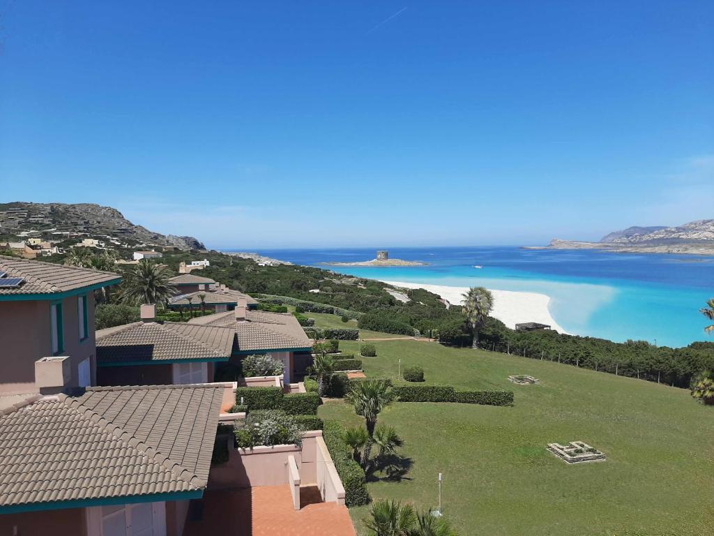 a view of the ocean from a house at Rocca Ruja Vip in Stintino