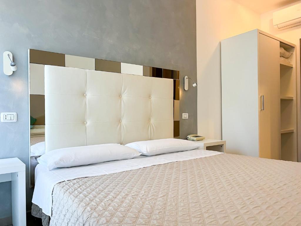Кровать или кровати в номере Hotel Brigantino