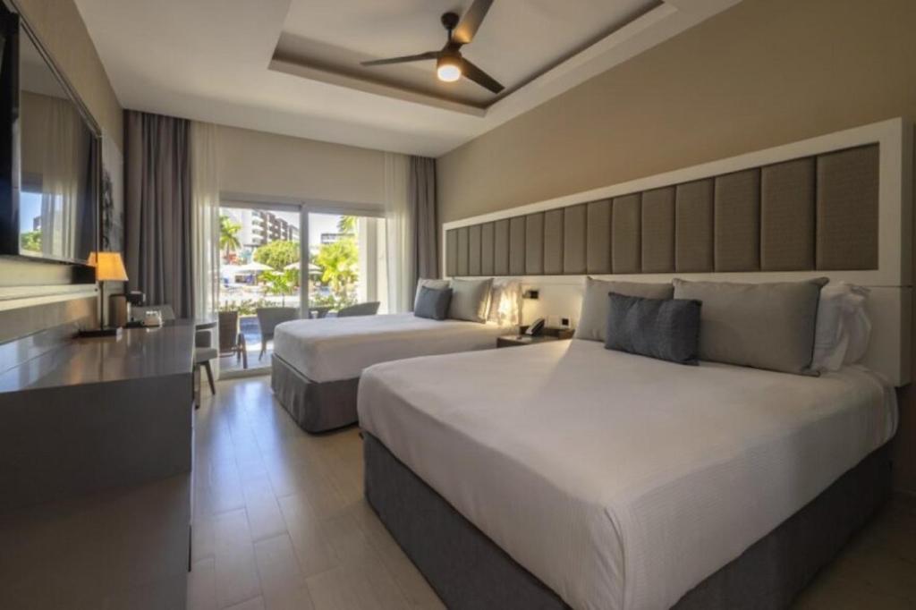 Voodi või voodid majutusasutuse Hideaway at Royalton Blue Waters, An Autograph Collection all-Inclusive Resort - Adults Only toas