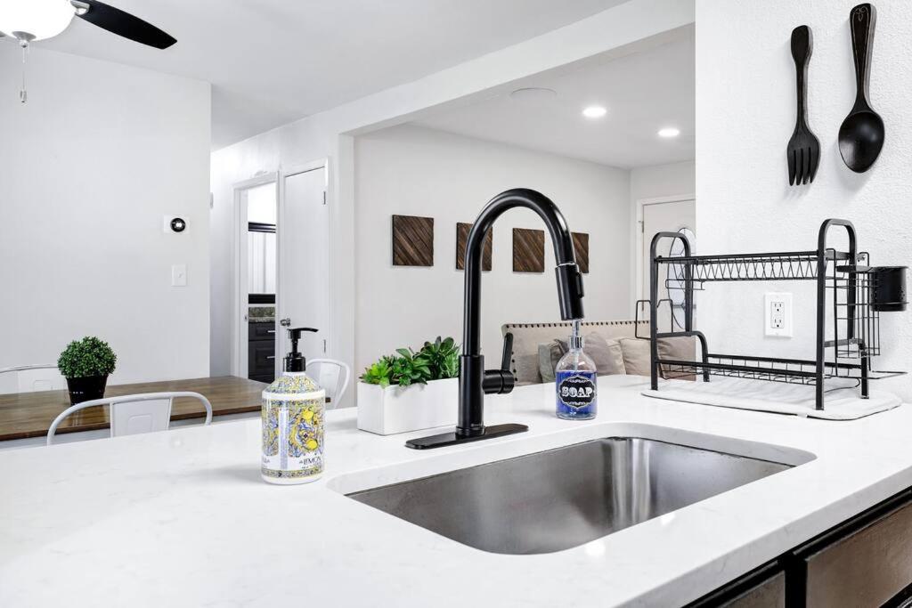 a kitchen with a sink and a counter top at Centrally Located Little Gem in San Antonio