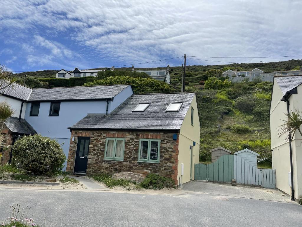 a house with solar panels on the roof at Driftwood in Porthtowan