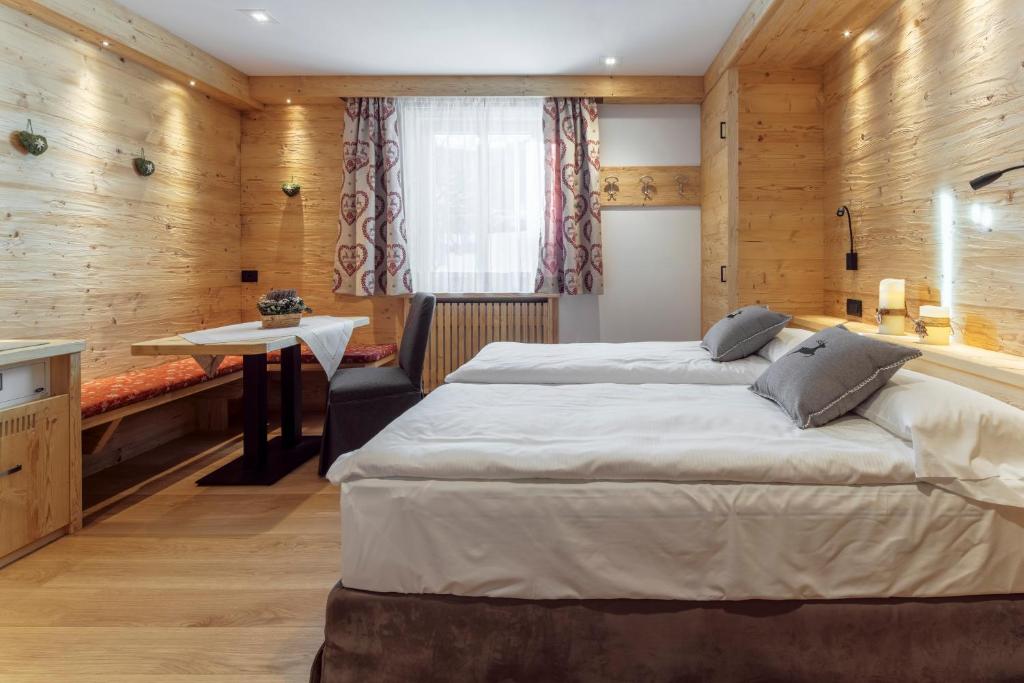 Łóżko lub łóżka w pokoju w obiekcie Hotel Columbia & Spa