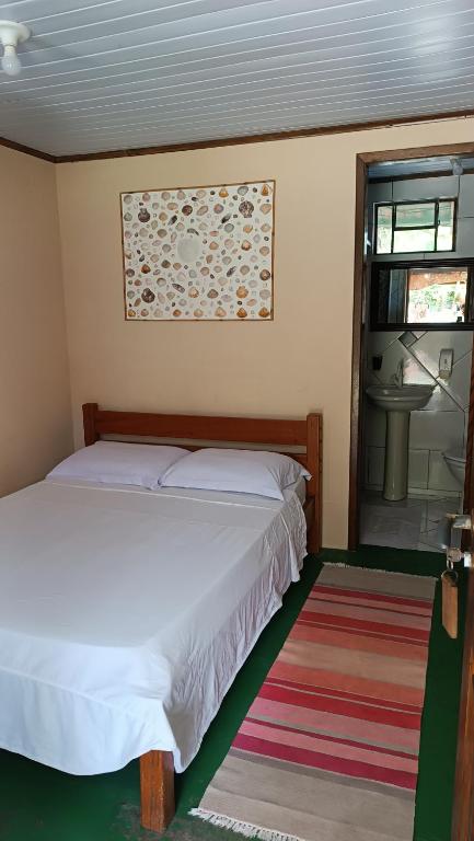 Cama ou camas em um quarto em Pousada Sobre as Ondas - ILHA DO MEL - PR