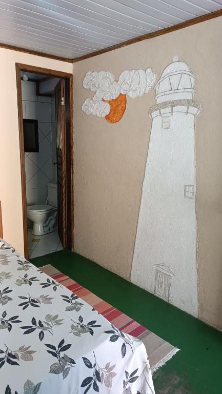 Cama ou camas em um quarto em Pousada Sobre as Ondas - ILHA DO MEL - PR