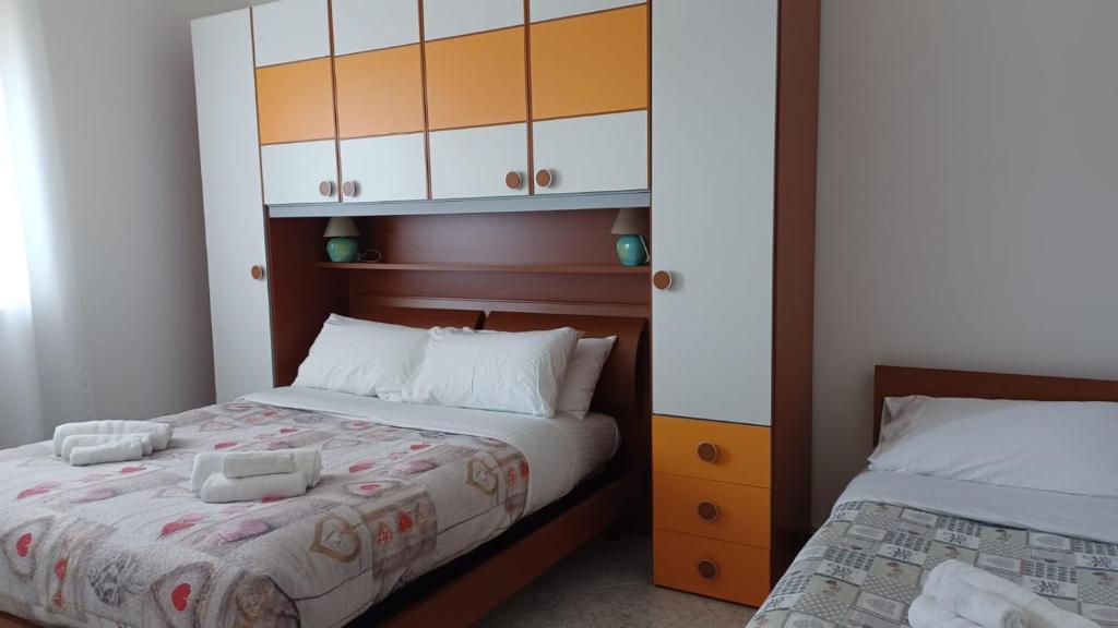 Posteľ alebo postele v izbe v ubytovaní Trulli in Martina Franca residence