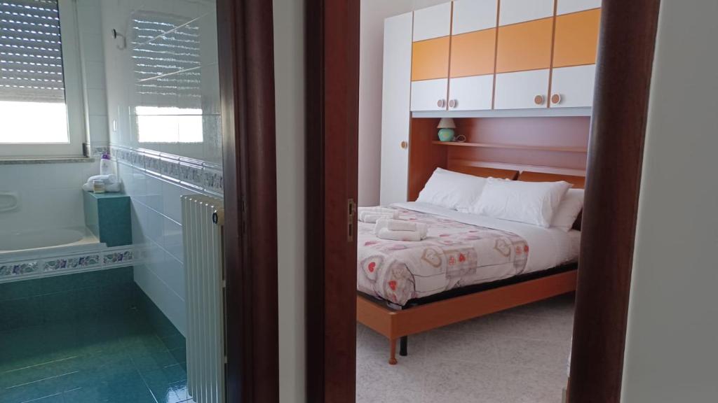 Posteľ alebo postele v izbe v ubytovaní Trulli in Martina Franca residence