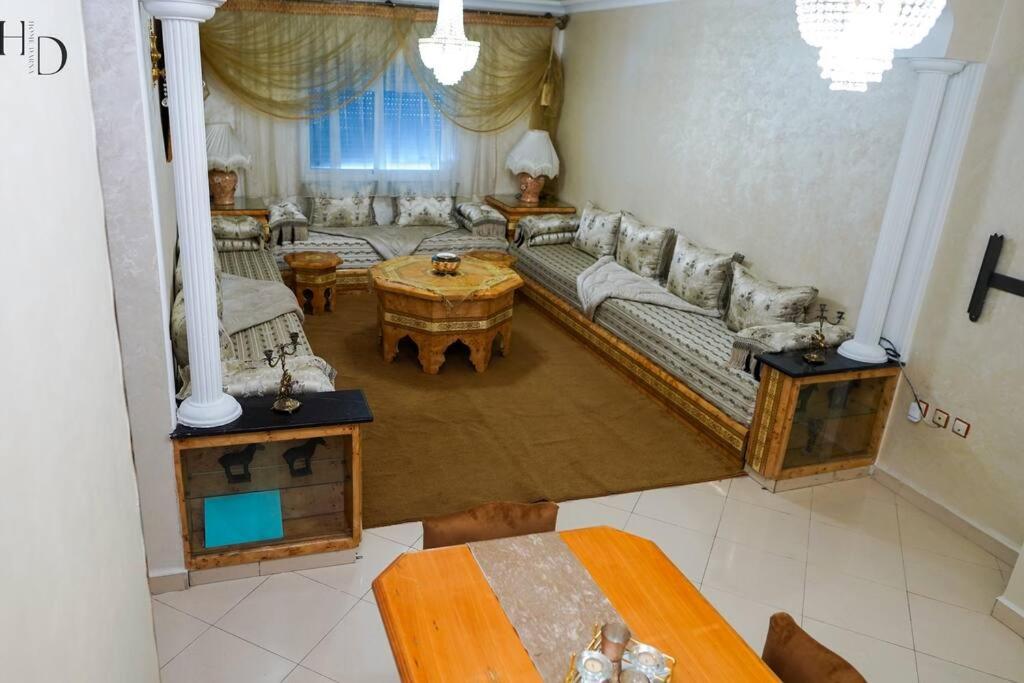 a living room with a couch and a table at Home Darna City Center in Tangier
