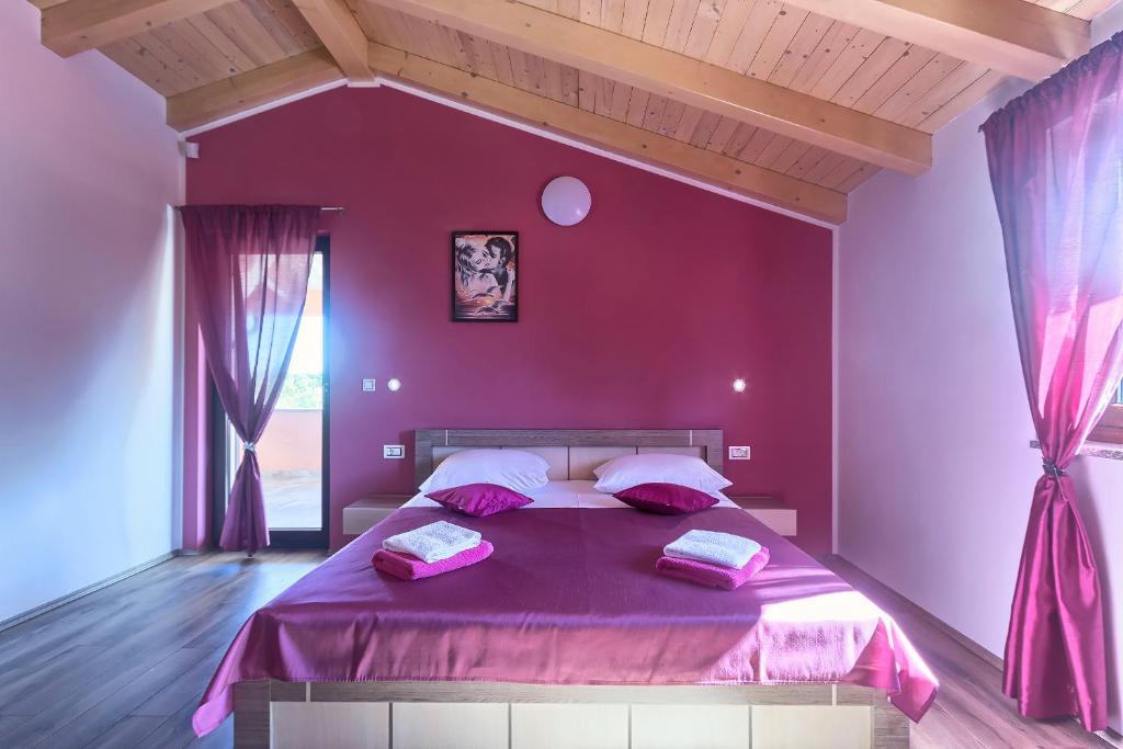 Postel nebo postele na pokoji v ubytování Villa Amber