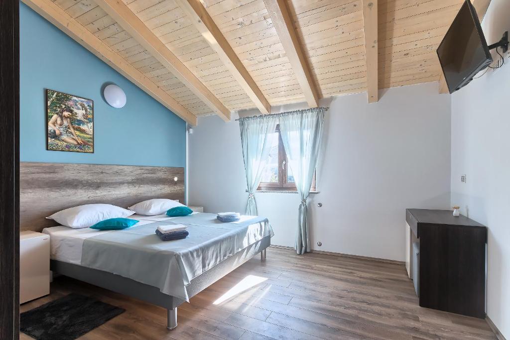 Postel nebo postele na pokoji v ubytování Villa Amber