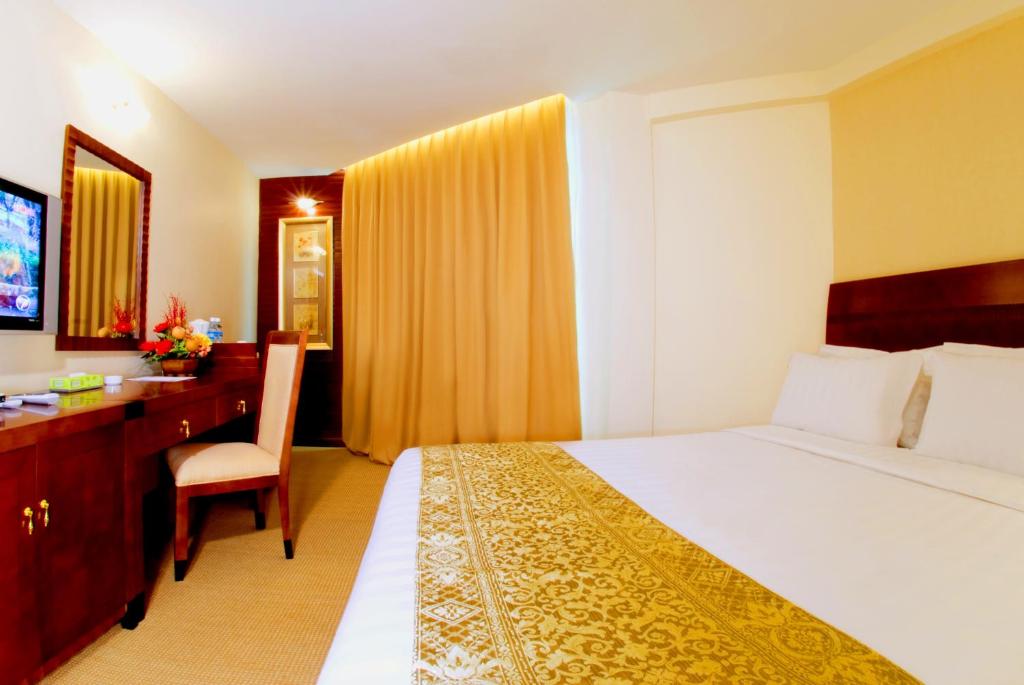 Postel nebo postele na pokoji v ubytování Celyn Hotel City Mall