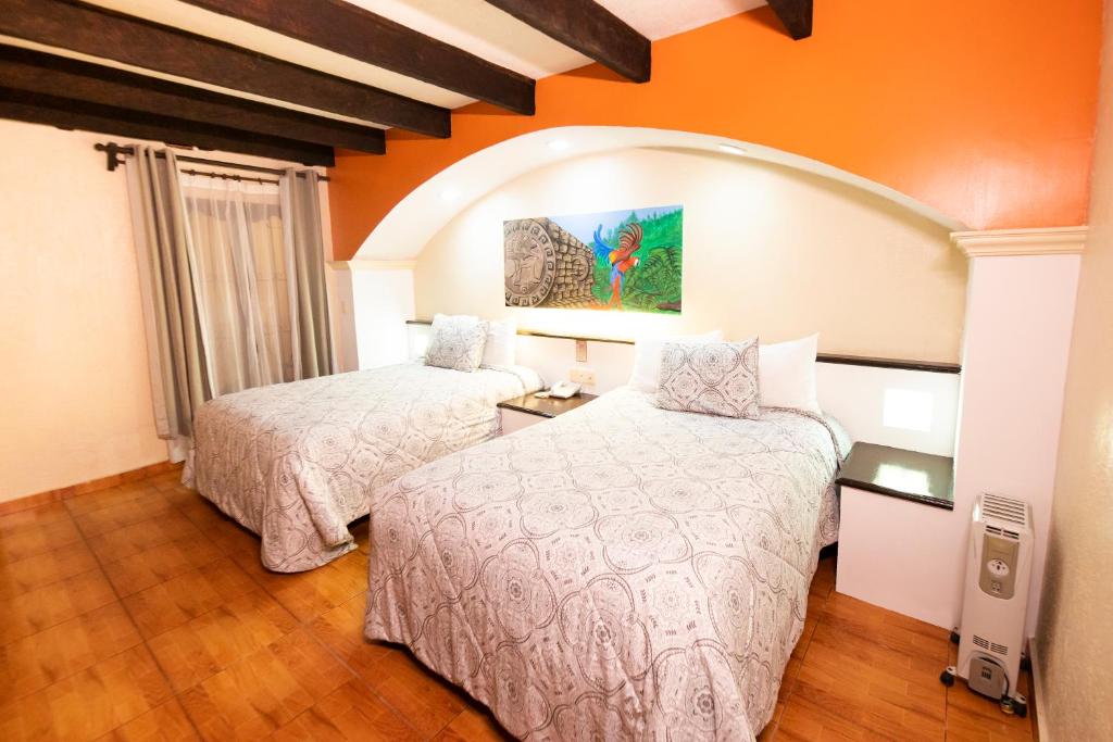 Postel nebo postele na pokoji v ubytování Hotel Catedral