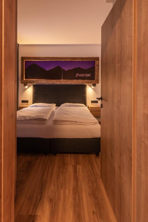 Postel nebo postele na pokoji v ubytování Feiserhof Navis - Appartements