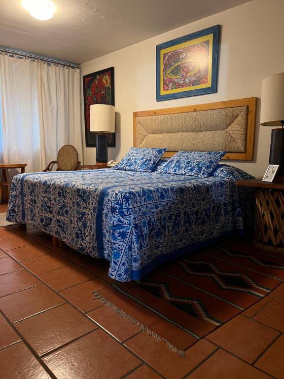 Postel nebo postele na pokoji v ubytování Casa Tlaquepaque