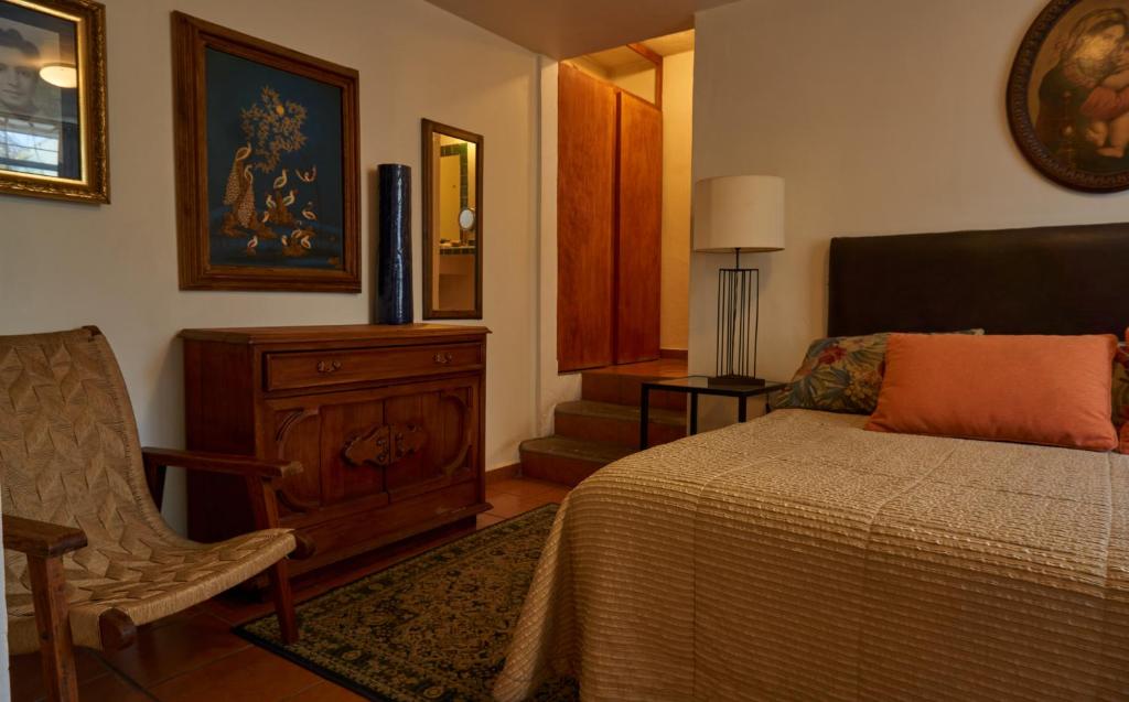 Postel nebo postele na pokoji v ubytování Casa Tlaquepaque