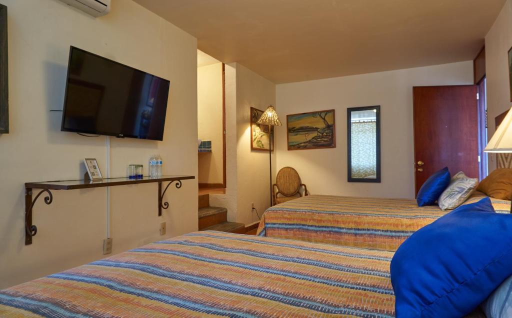 Postel nebo postele na pokoji v ubytování Casa Tlaquepaque