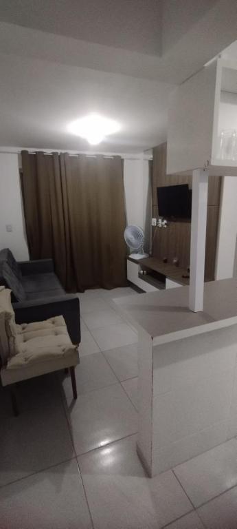 TV a/nebo společenská místnost v ubytování Apto familiar c/ piscina, próx as praias reg Sul