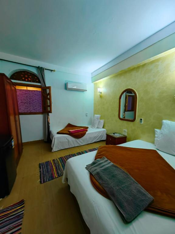 Postel nebo postele na pokoji v ubytování Gina Motel Dahab