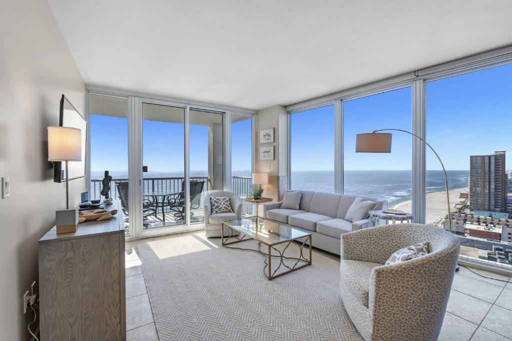 a living room with a view of the ocean at Island Tower 2103 in Gulf Shores