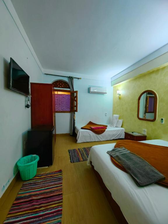 Postel nebo postele na pokoji v ubytování Gina Motel Dahab