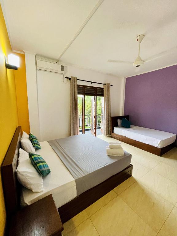 Postel nebo postele na pokoji v ubytování Ravan Resort Tangalle