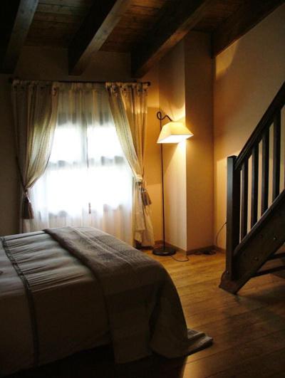 Postel nebo postele na pokoji v ubytování Hotel Areulo