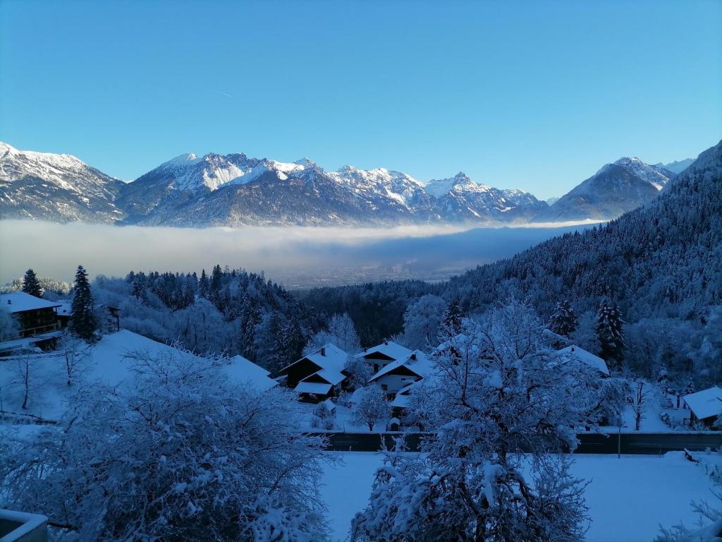a snow covered valley with mountains in the background at Landhaus Berthold in Bürserberg