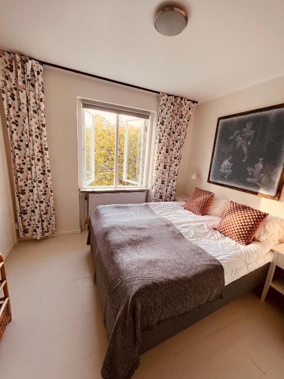 Postel nebo postele na pokoji v ubytování Gåsen Out B&B