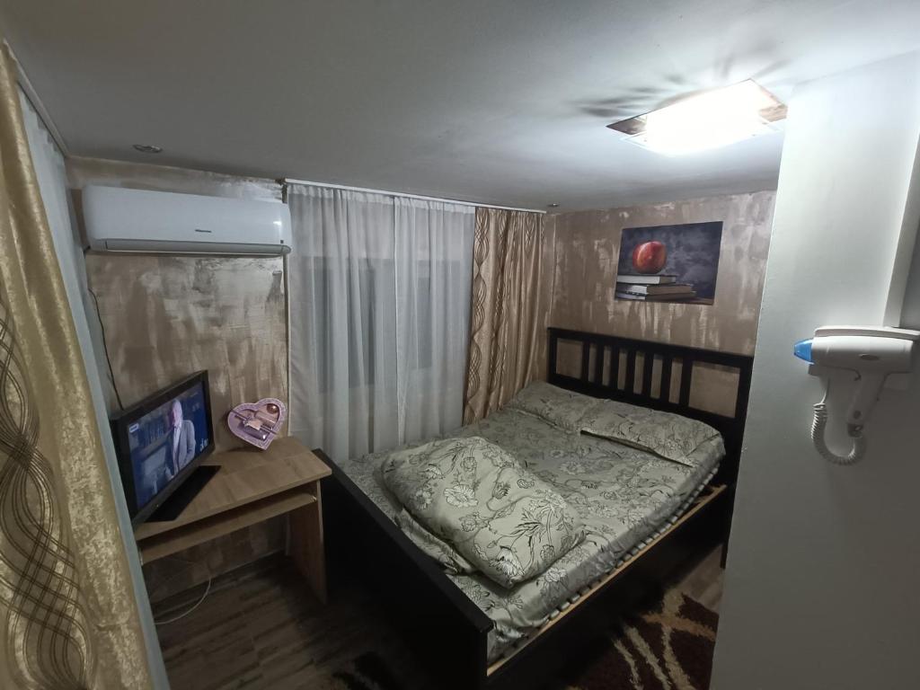 Postel nebo postele na pokoji v ubytování Pensiunea Casa Bianca