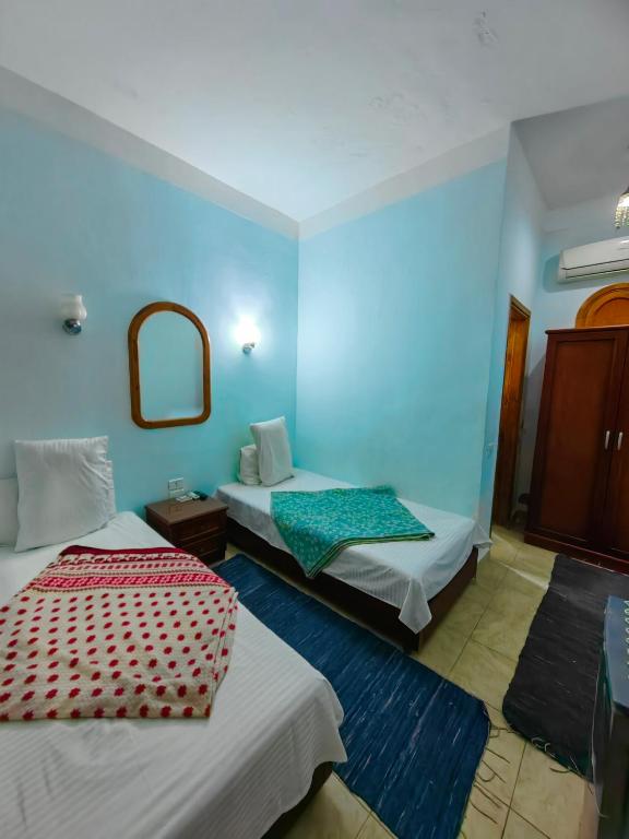 Postel nebo postele na pokoji v ubytování Gina Motel Dahab