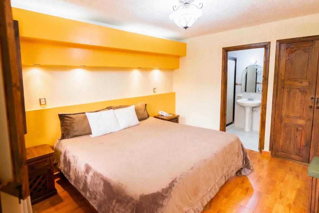 Postel nebo postele na pokoji v ubytování Gran Hotel El Encanto