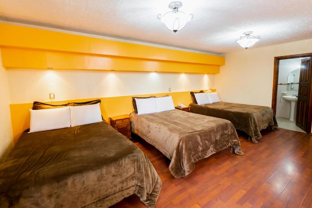 Postel nebo postele na pokoji v ubytování Gran Hotel El Encanto