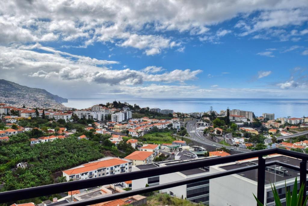 a city view from the balcony of a building at Design Gardens, a Home in Madeira in Funchal