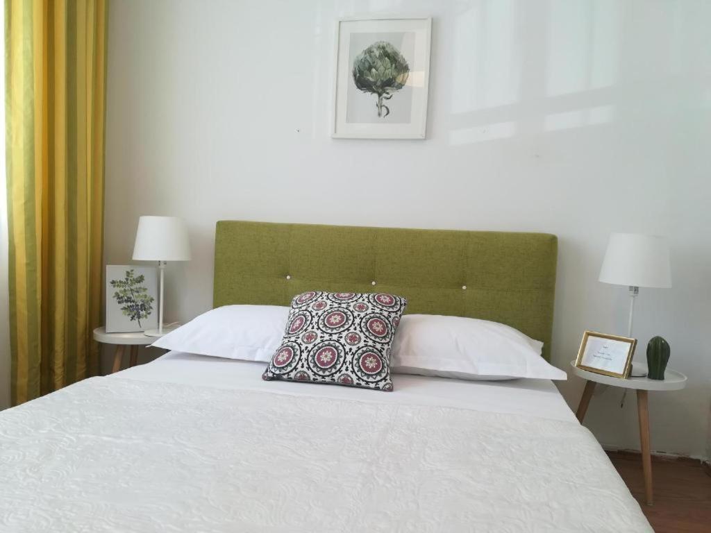 Postel nebo postele na pokoji v ubytování Guesthouse Smart