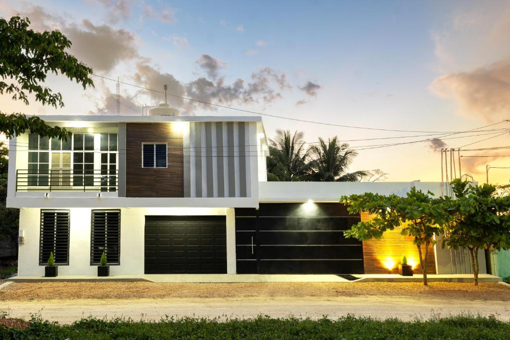 a house with a black and white facade at Casa Valencia 2 in Santa Elena