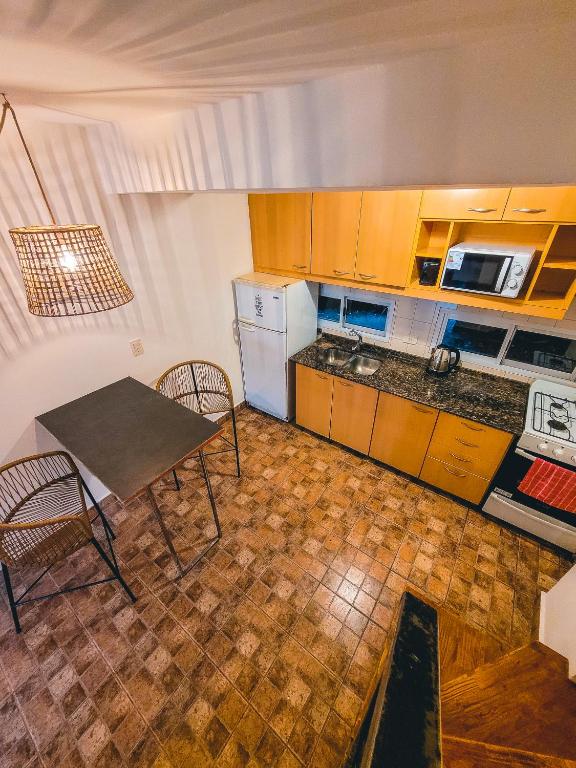 Kuchyň nebo kuchyňský kout v ubytování Cabaña Oasis