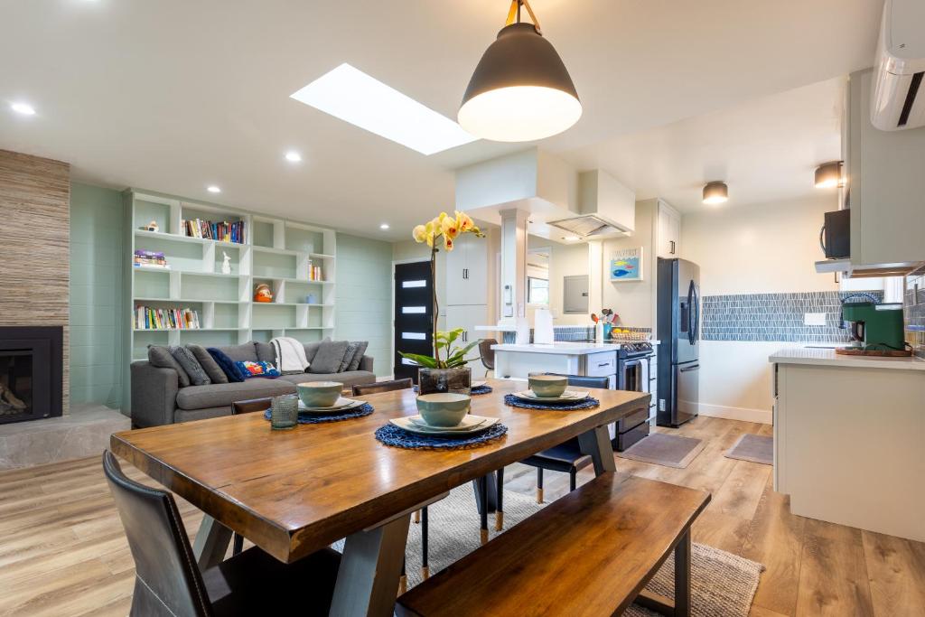a kitchen and living room with a wooden table and a dining room at Downtown Mill Valley Modern Cozy Upstairs Apartment in Best San Francisco Bay Area in Mill Valley