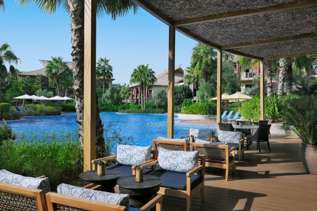 a patio at the resort with a view of the water at Lapita, Dubai Parks and Resorts, Autograph Collection in Dubai