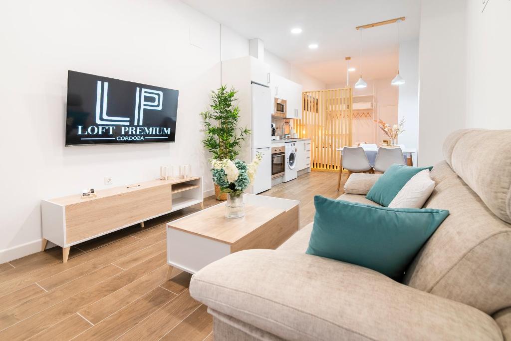 a living room with a couch and a table at Loft Premium Córdoba in Córdoba